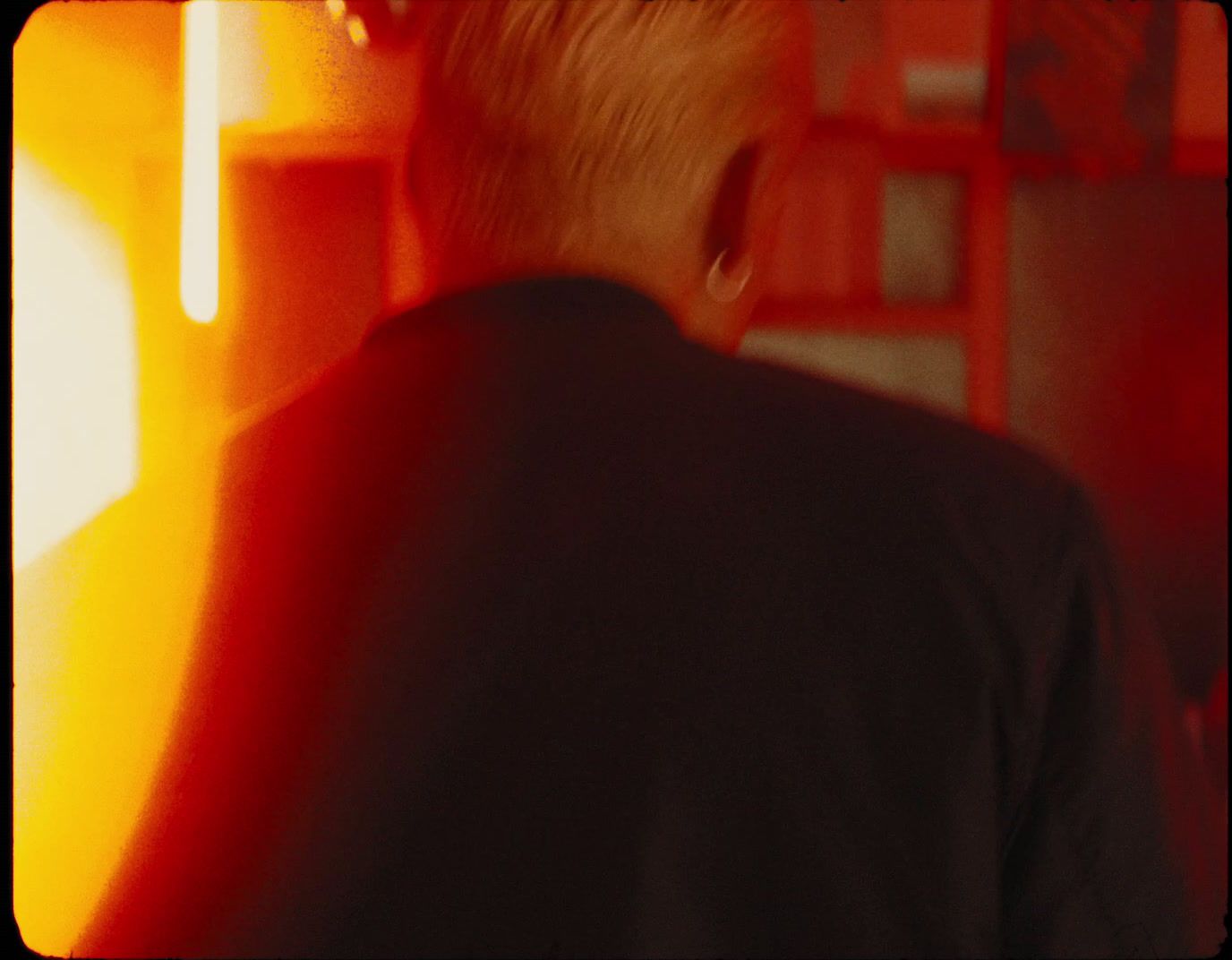 a man standing in a room with a ladder