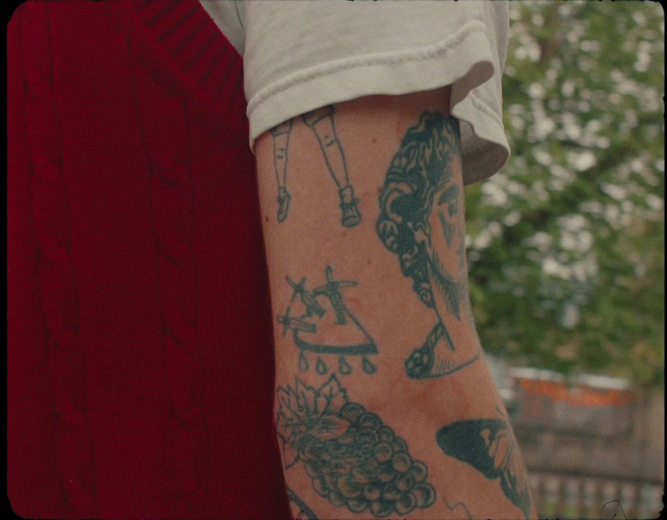 a close up of a person with a tattoo on his arm