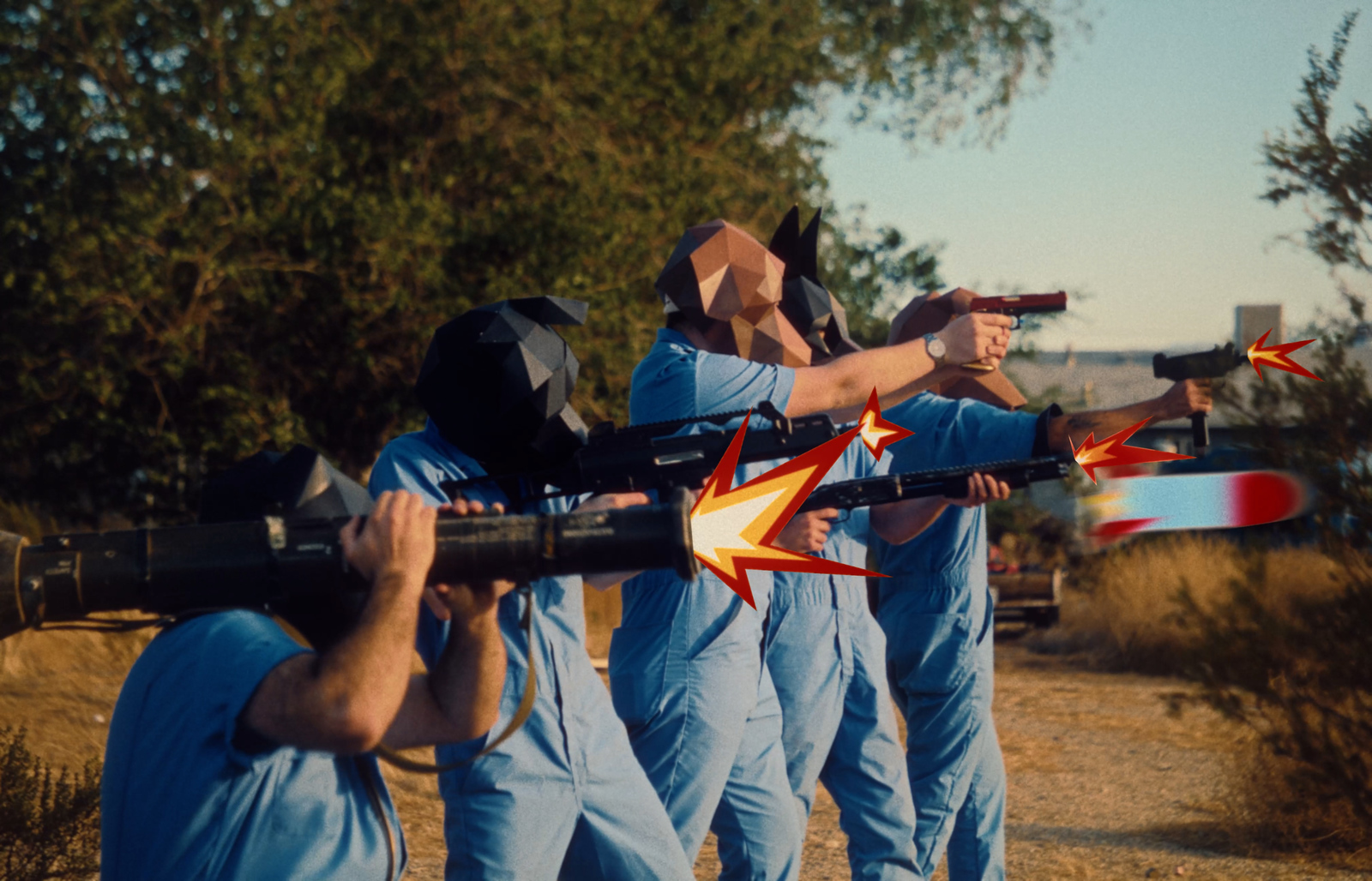 a group of men in blue jumps holding guns