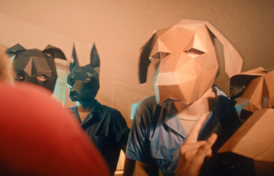 a group of people wearing paper masks standing next to each other