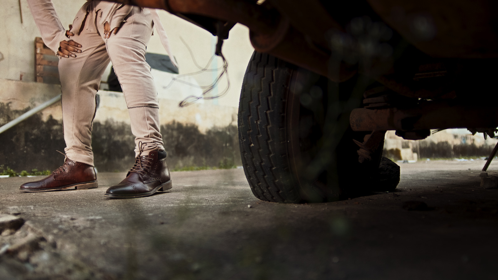 a close up of a person standing next to a car