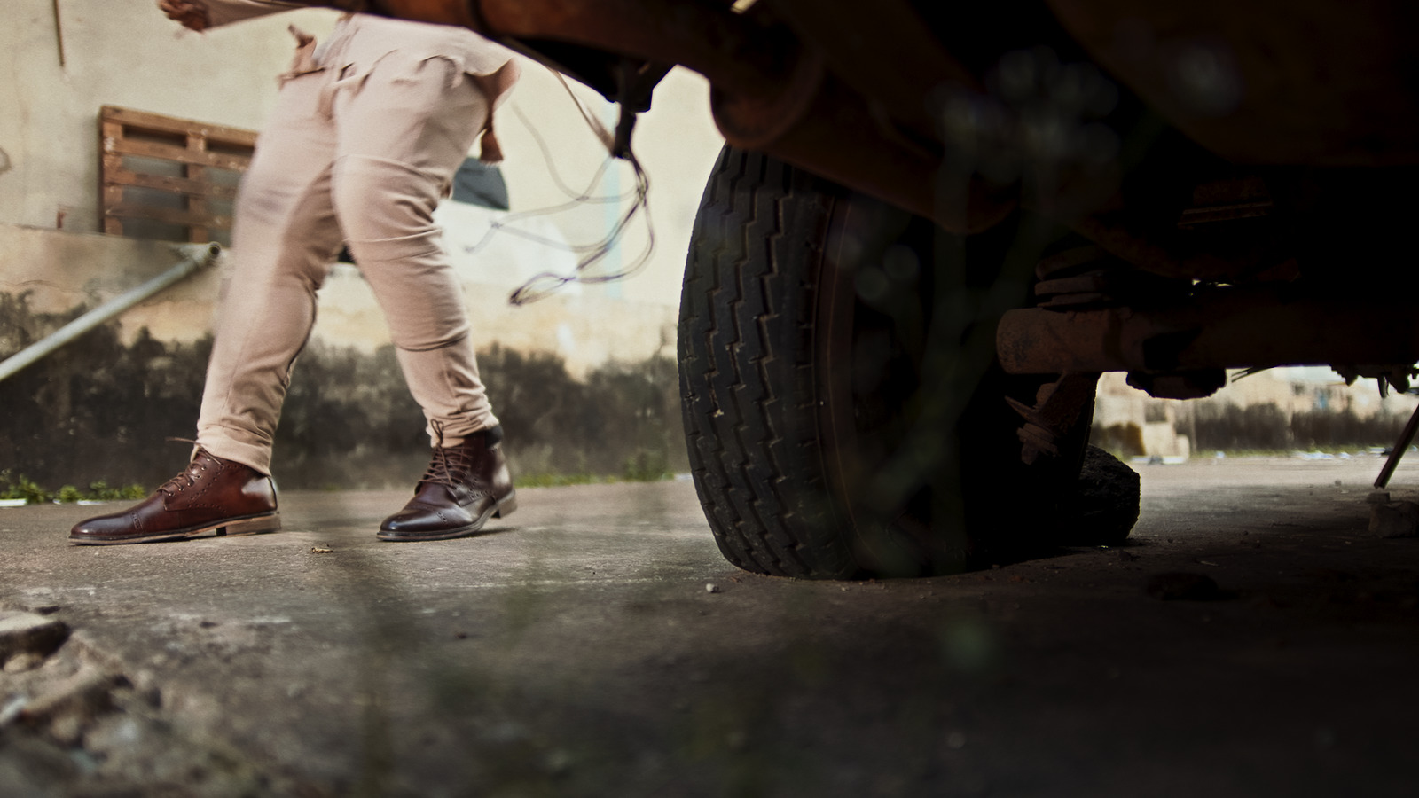 a close up of a person standing next to a car