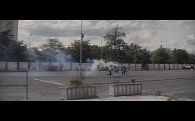 a group of people standing in a parking lot