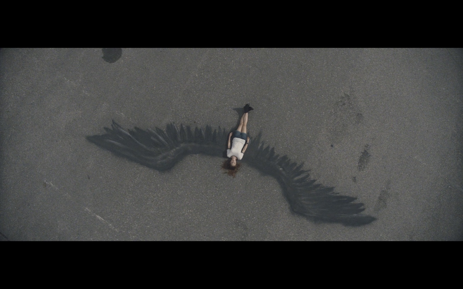 an aerial view of a person laying on the ground