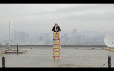 a man is standing on top of a building