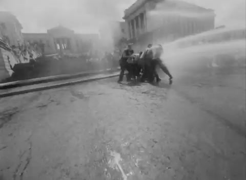 a group of people standing around a fire hydrant