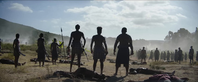 a group of men standing next to each other on a field