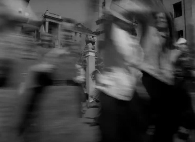 a blurry photo of people walking down a street