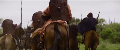 a group of men riding on the backs of horses