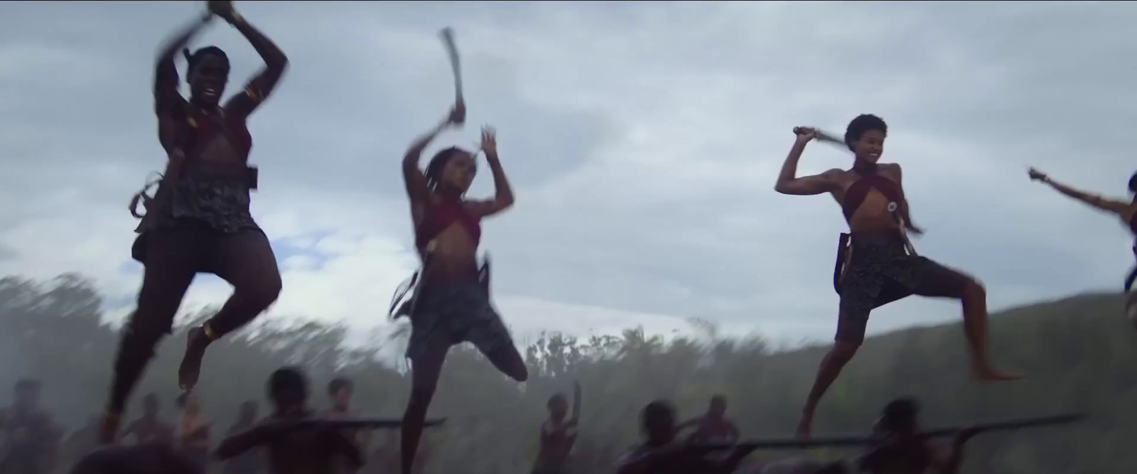 a group of people jumping in the air