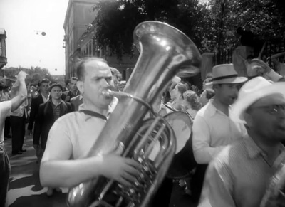 a black and white photo of a man playing a trumpet