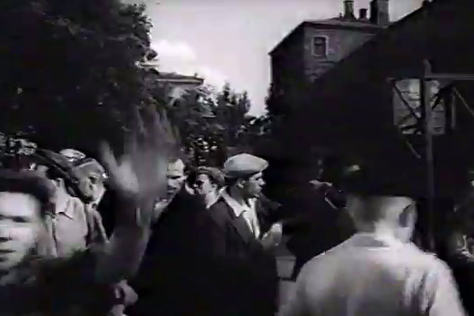 a black and white photo of a crowd of people