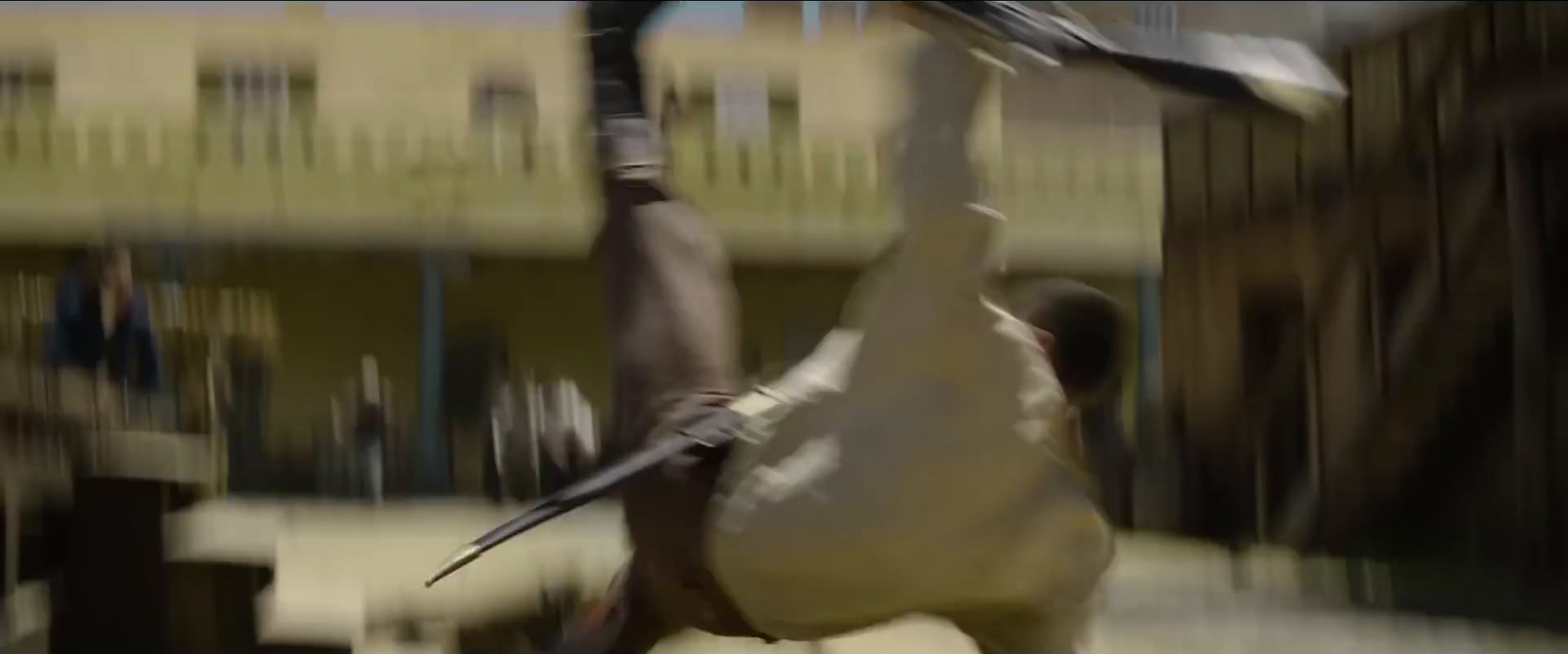 a blurry image of a man holding a bat