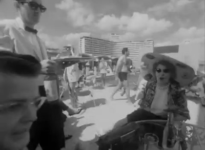 a black and white photo of people on a beach