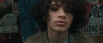 a close up of a person with curly hair