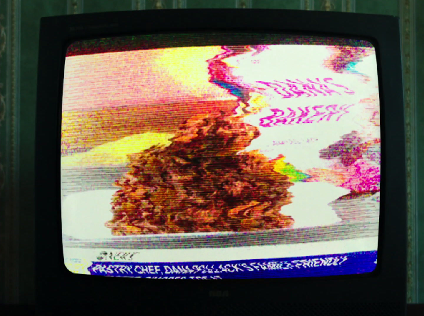 a television with a picture of a pile of food on it