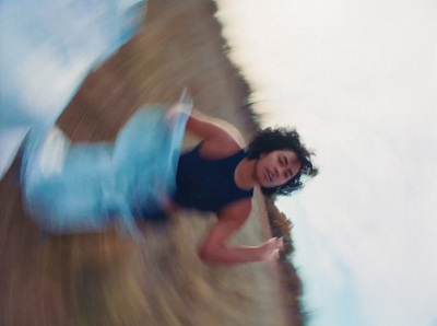 a blurry photo of a woman in a bathing suit