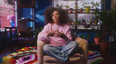 a woman sitting in a chair with a teddy bear