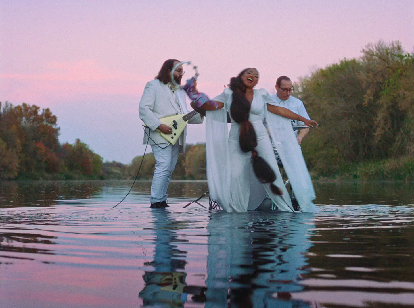 a group of people that are standing in the water