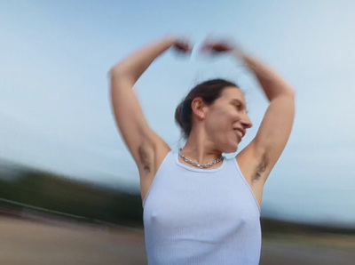 a blurry photo of a woman in a tank top