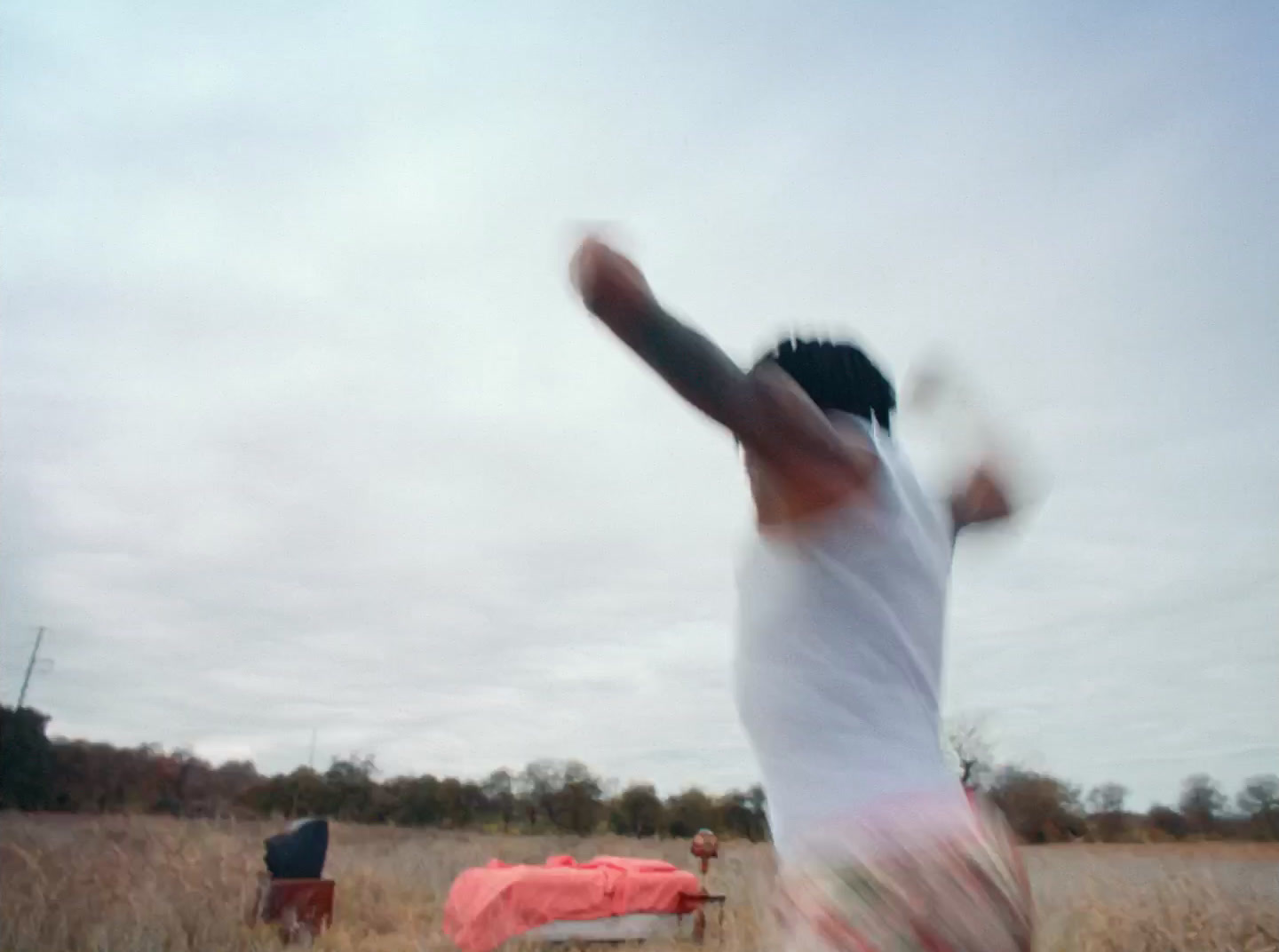 a blurry photo of a man throwing a frisbee