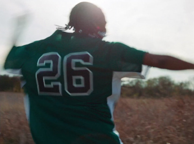 a baseball player is throwing a ball in a field