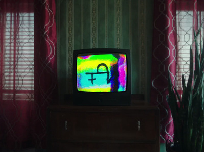 a television sitting on top of a wooden dresser