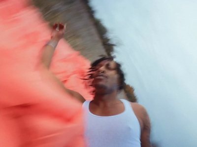 a blurry photo of a man in a tank top