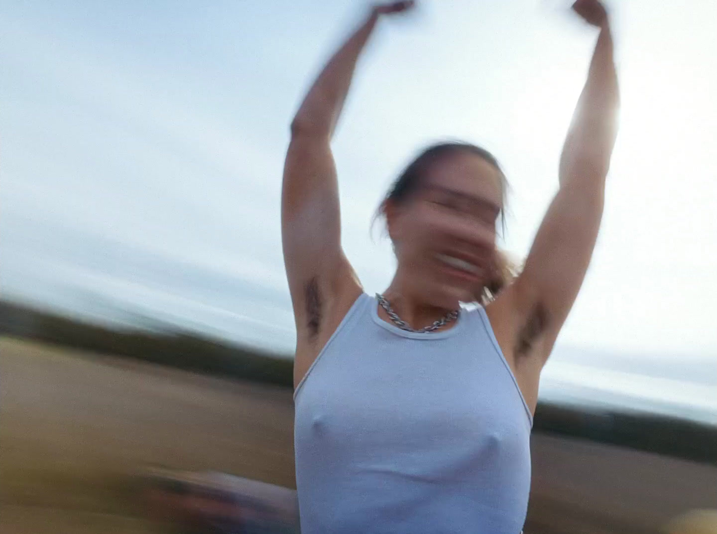 a blurry photo of a woman holding a frisbee