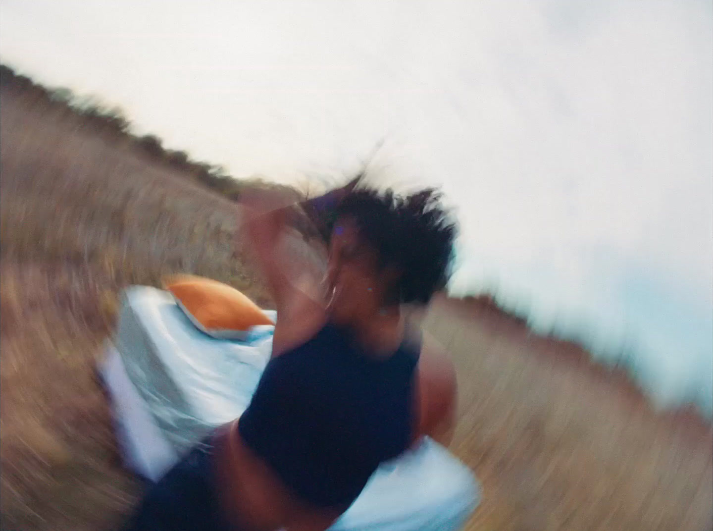 a blurry photo of a woman running in a field