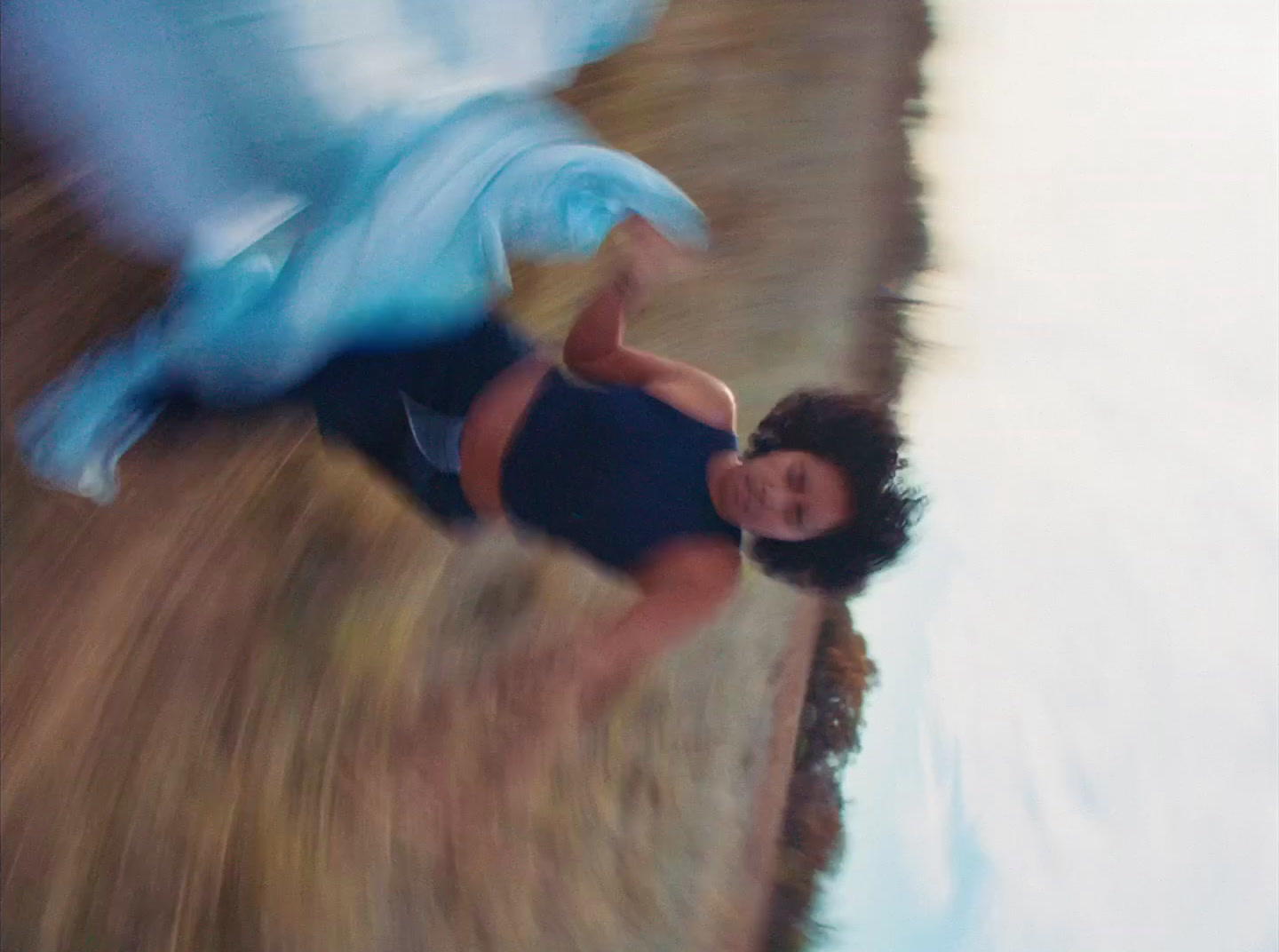 a blurry photo of a woman in a bathing suit