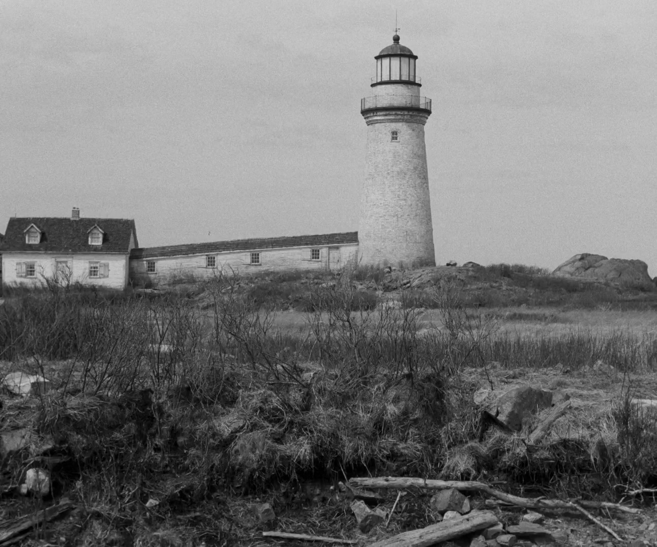 a black and white photo of a lighthouse