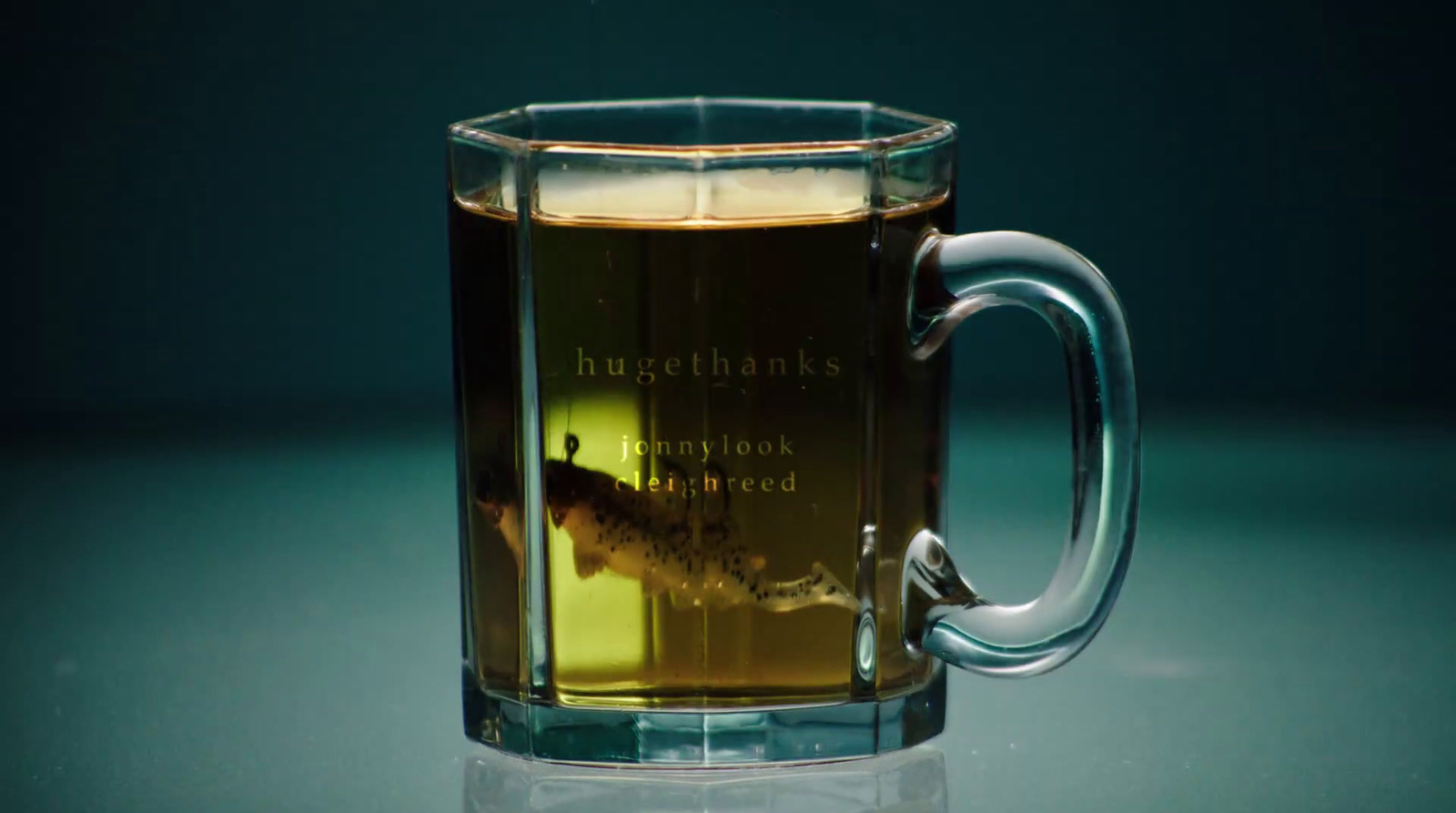 a glass mug with a liquid inside of it