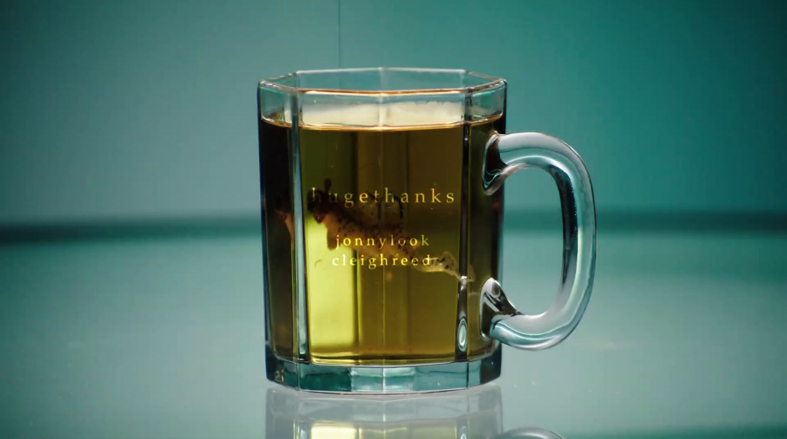 a glass mug with a liquid inside of it