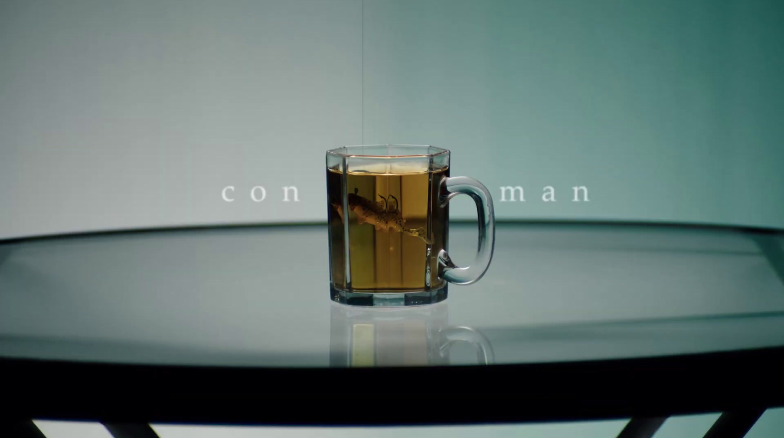 a glass of tea sitting on top of a table