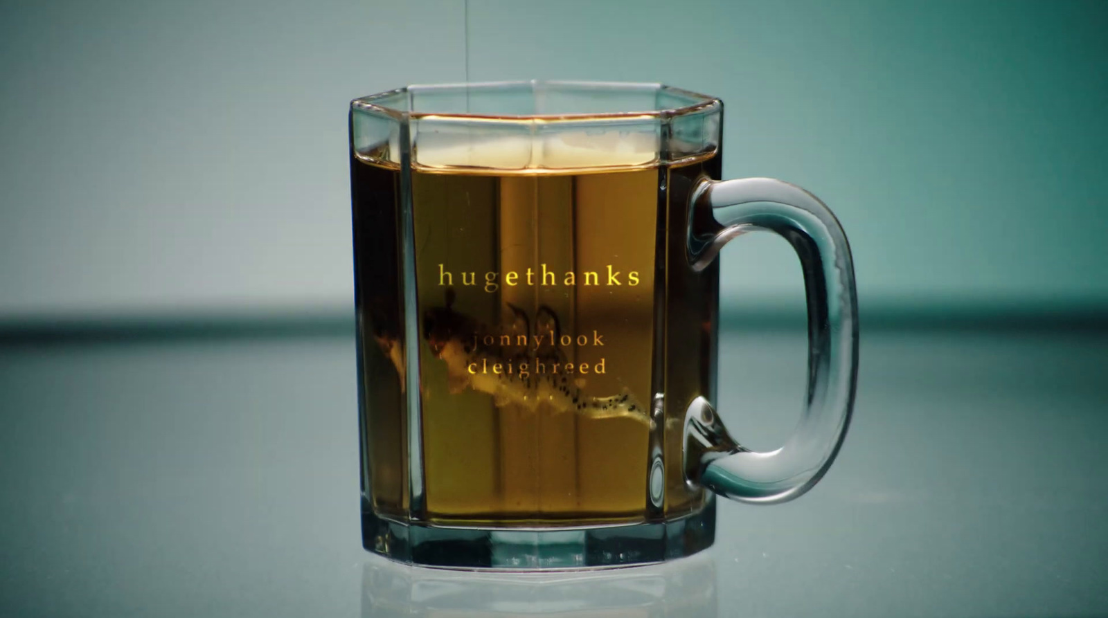 a glass mug with a liquid inside of it