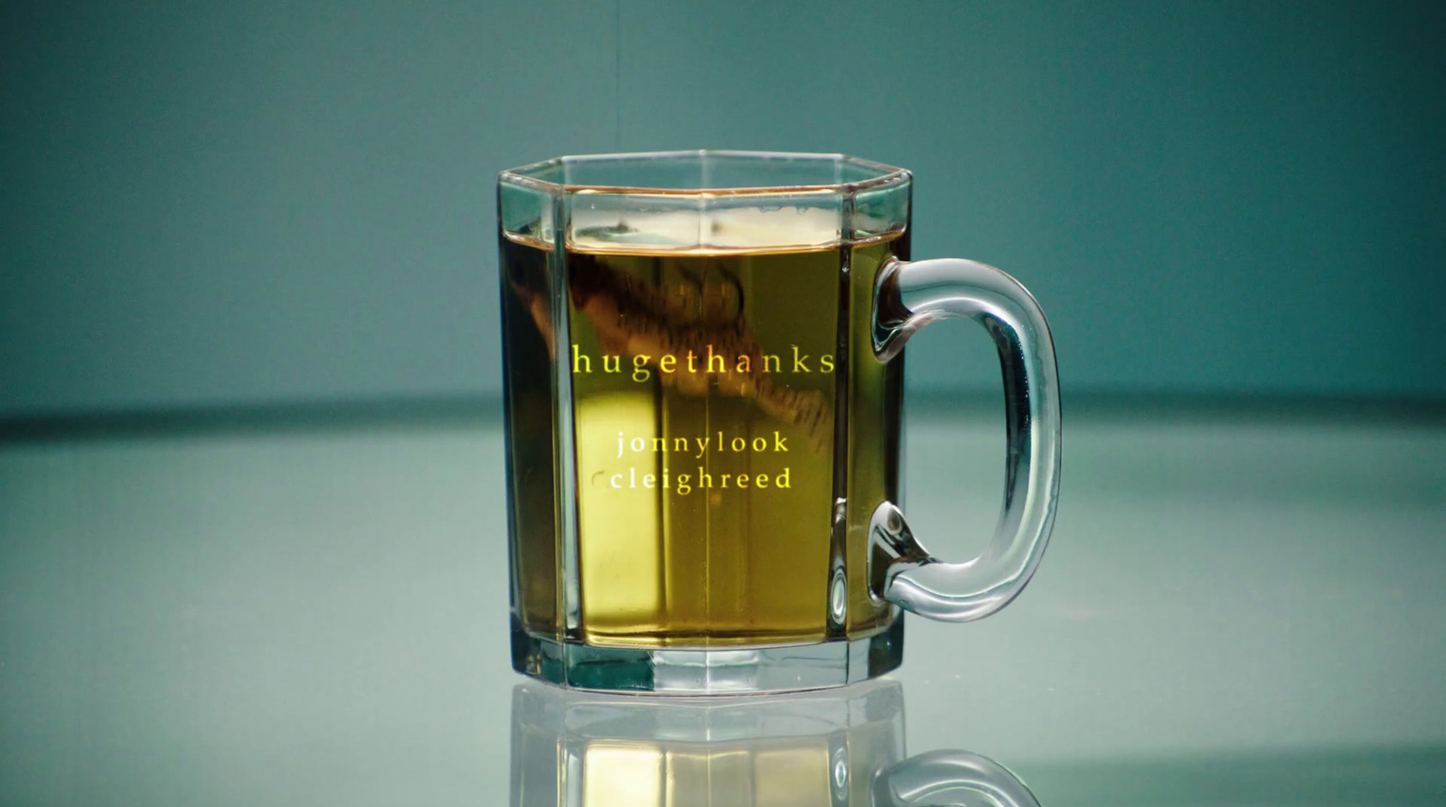 a glass mug with a liquid inside of it