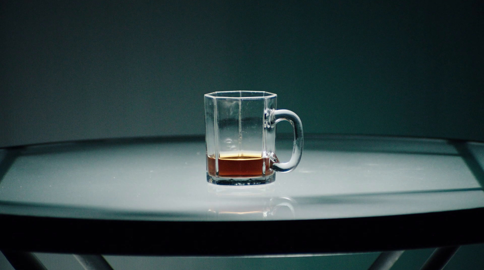 a glass of tea sits on a table