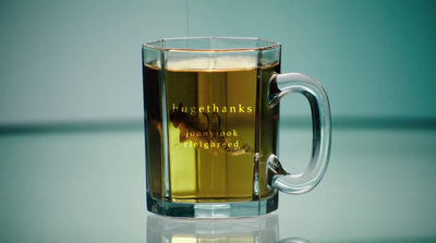 a glass mug with a liquid inside of it