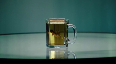 a glass cup of tea on a table