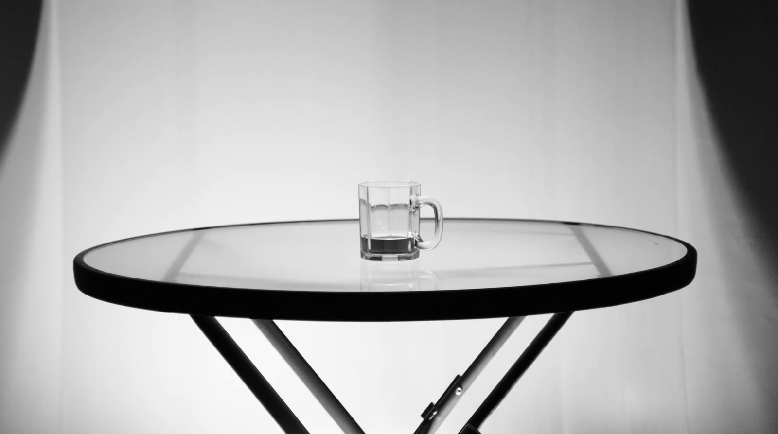 a glass table with a pen on top of it