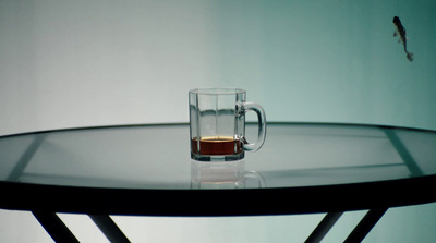 a glass of tea sitting on top of a table