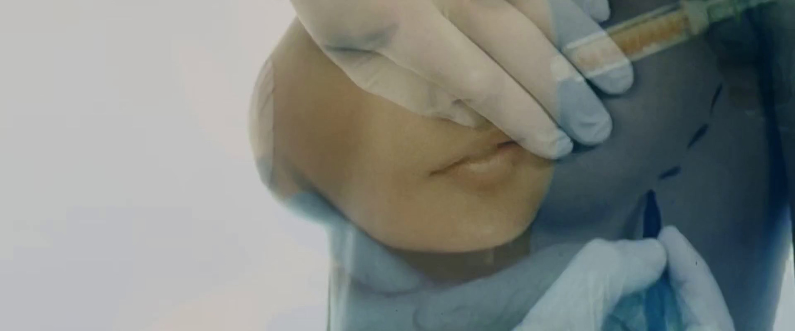 a woman getting her nose examined by a doctor