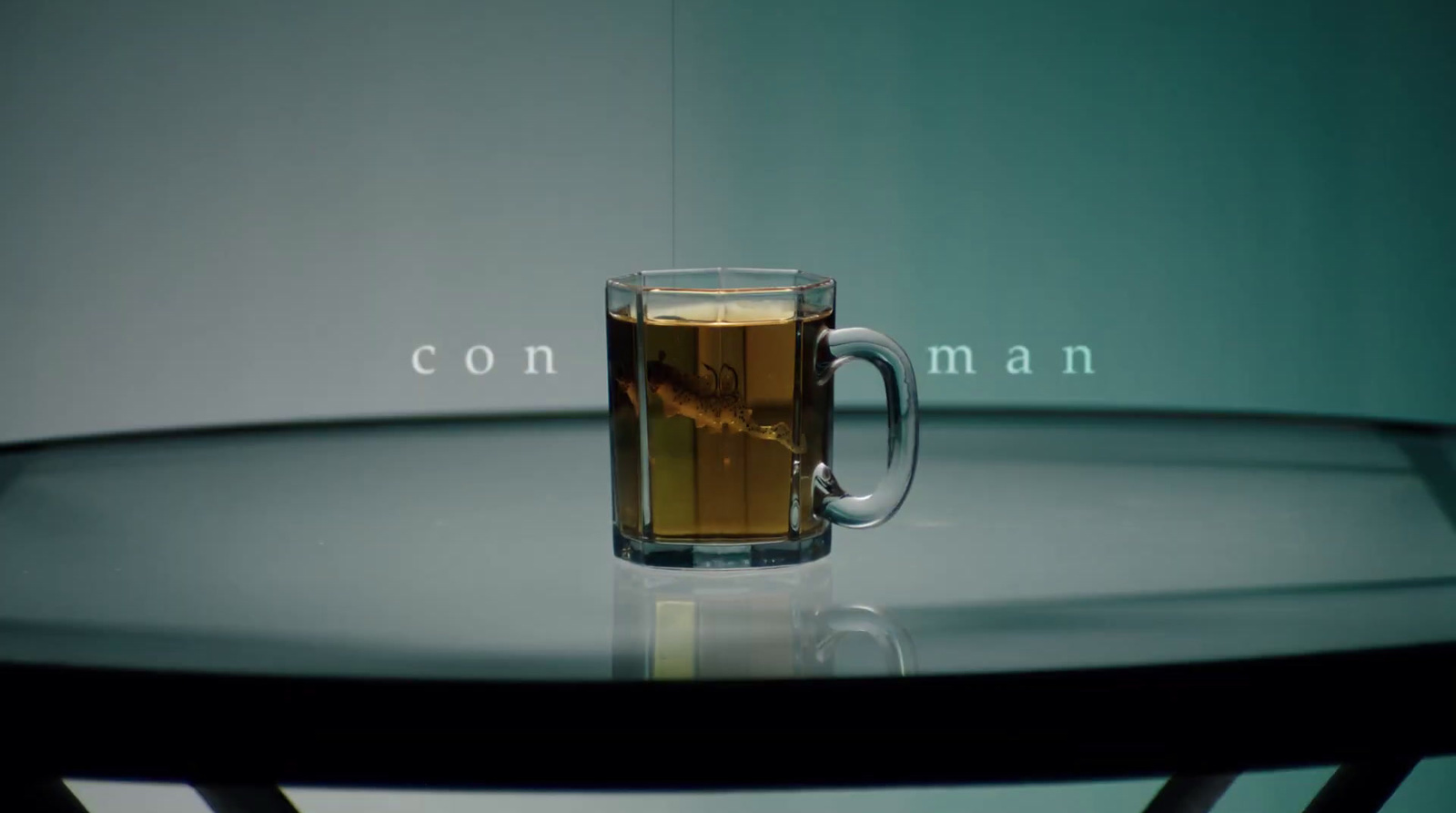 a glass of tea sitting on top of a table