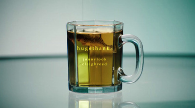 a glass mug with a liquid inside of it