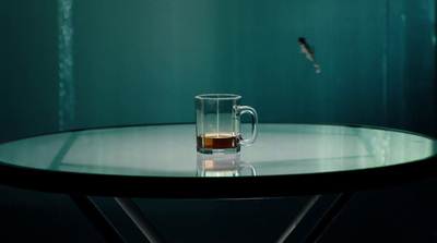 a glass of tea sits on a table