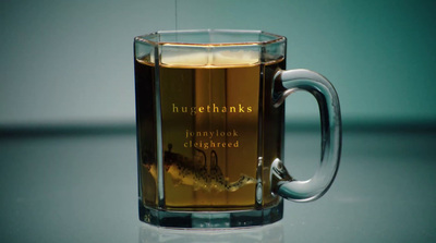 a glass mug with a liquid inside of it