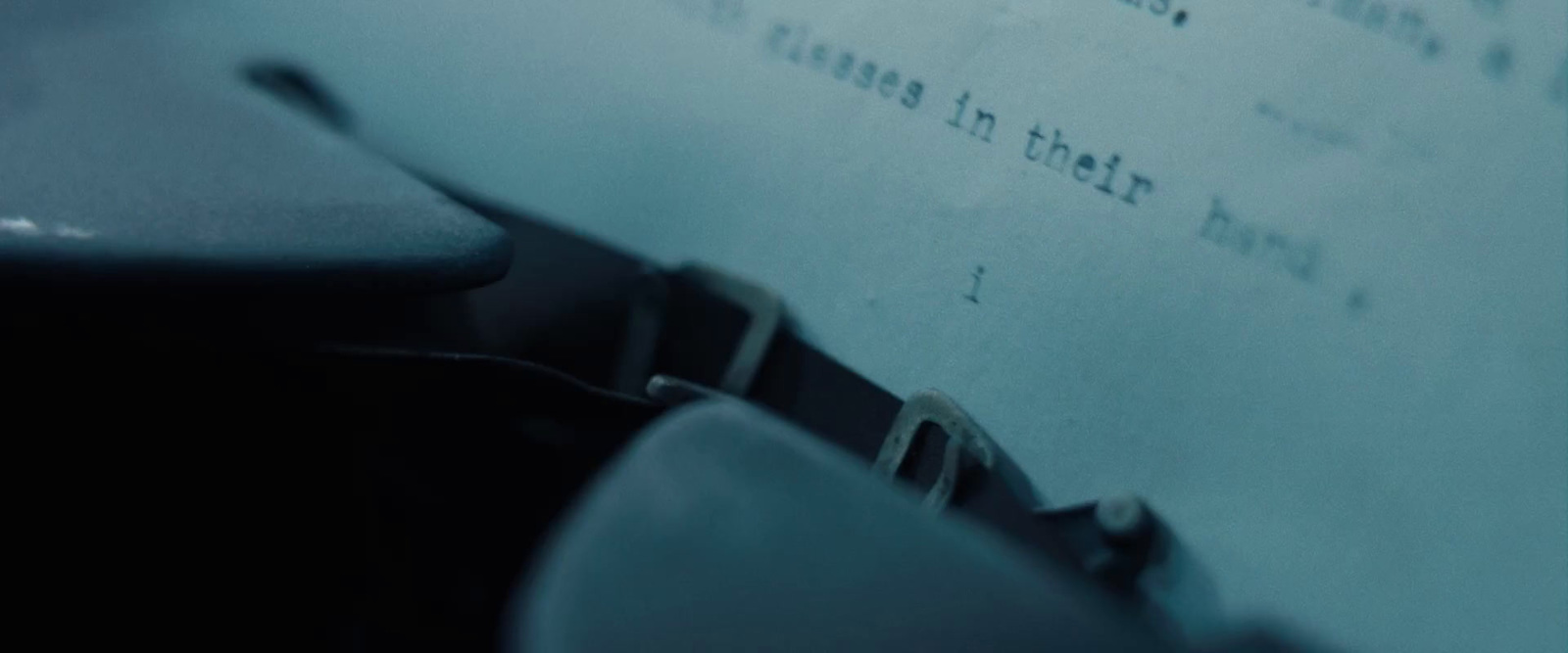 a close up of a typewriter with a sheet of paper