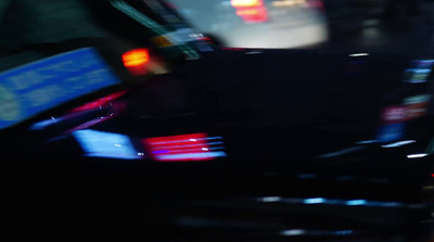 a blurry image of a city street at night