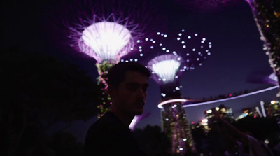 a man standing in front of fireworks at night